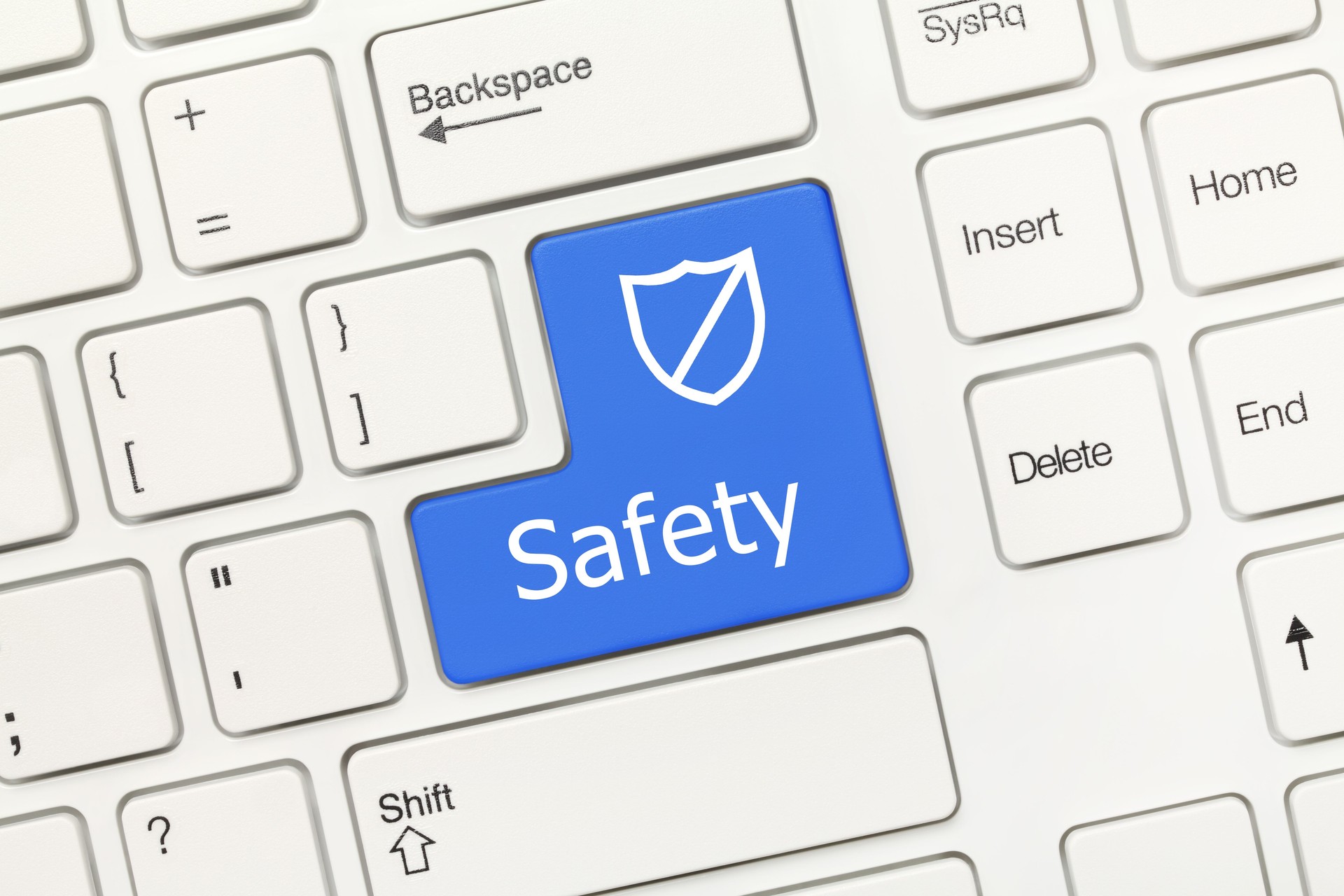 White conceptual keyboard - Safety (blue key with shield)